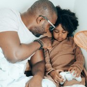 AA dad comforting upset child