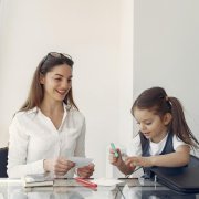 Mother and young daughter talking