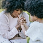 AA mom helping child regulate emotions