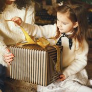 Girl opening holiday gift