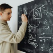High school boy at chalkboard