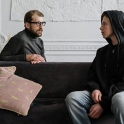 Male social worker talking with boy