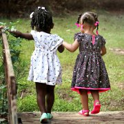 Girls holding hands – summertime