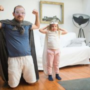Parent and child dressed as superheroes