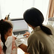 Parent helping child with homework