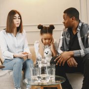 Emotional child with parents