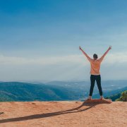 Arms outstretched toward horizon