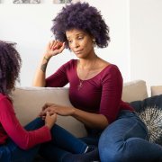 AA mother and daughter talking